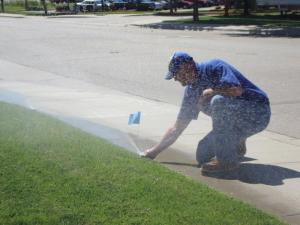 Mike is checking a sprinkler system