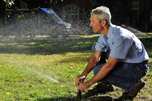 Peter, one of our Keller sprinkler repair team is adjusting sprinkler head